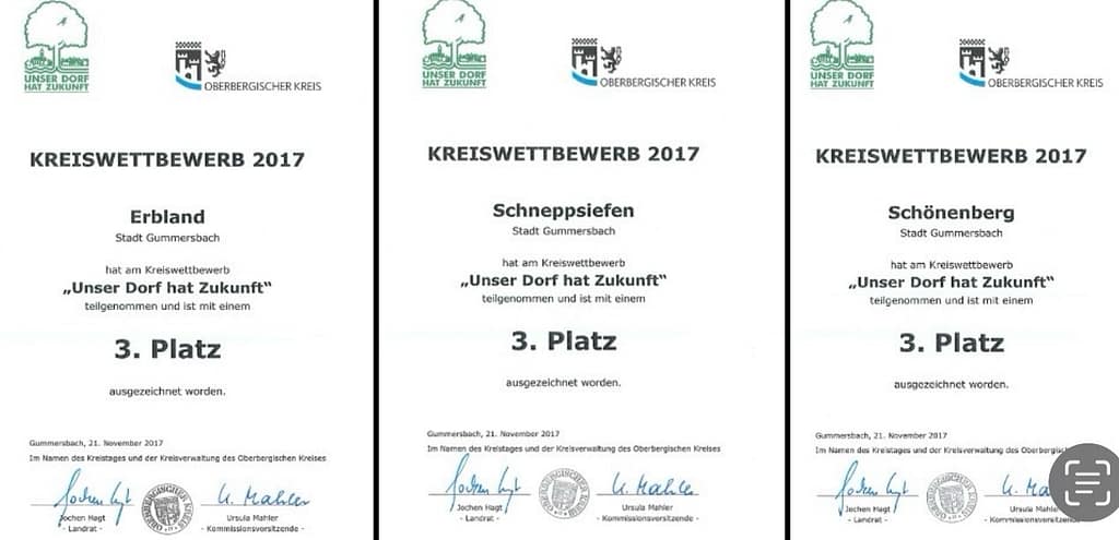 Drei Urkunden für den Wettbewerb 'Unser Dorf hat Zukunft' aus den Jahren 2017 für Erbland, Schneppsiefen und Schönenberg.